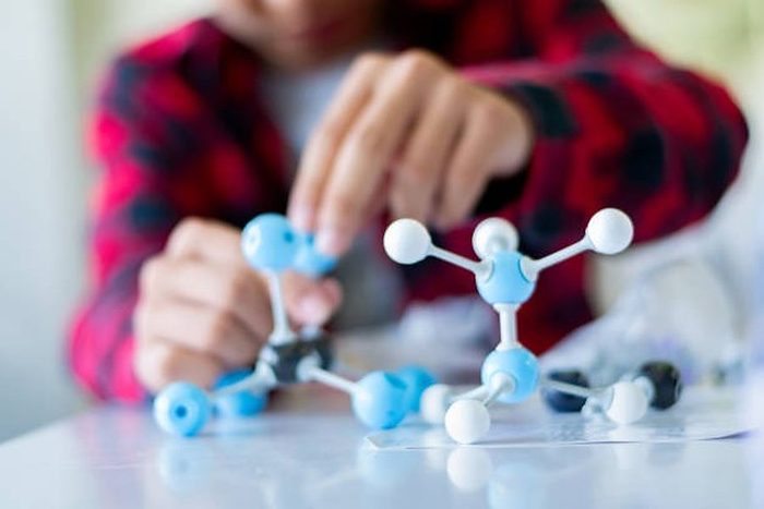 A child building a molecular model, for the chemistry classes